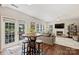 Living room with dining table, large sofa, and lots of natural light at 7833 Taymouth Ln, Charlotte, NC 28269