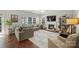 Spacious living room features hardwood floors, a fireplace, and comfortable seating at 7833 Taymouth Ln, Charlotte, NC 28269