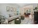 Comfortable living room next to dining room, featuring stylish furniture and large windows for natural light at 7833 Taymouth Ln, Charlotte, NC 28269