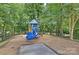 This is a playground with a slide, set within a secure fenced area and surrounded by lush trees at 7833 Taymouth Ln, Charlotte, NC 28269