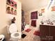 Bathroom featuring a toilet, vanity with sink, and shower with floral curtain at 815 Fescue Ct, Charlotte, NC 28216