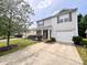 Well-maintained two-story home with a nicely landscaped front yard and a driveway at 815 Fescue Ct, Charlotte, NC 28216