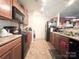 Functional kitchen with plenty of cabinet space, appliances and a black range at 815 Fescue Ct, Charlotte, NC 28216