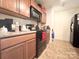 Functional kitchen with wood cabinets and modern appliances at 815 Fescue Ct, Charlotte, NC 28216