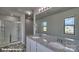 The main bathroom showcases a double vanity with granite counters and a glass enclosed shower at 820 Candy Dr, Statesville, NC 28677