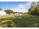 Expansive backyard with mature trees, shed and partial fence is ready for Gathering fun at 975 Mt Moriah Church Rd, China Grove, NC 28023