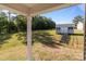 View from a covered porch looking out to the spacious and fenced backyard with shed at 975 Mt Moriah Church Rd, China Grove, NC 28023