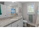 Well-lit bathroom featuring granite countertops, a single sink, and a shower with curtain at 975 Mt Moriah Church Rd, China Grove, NC 28023