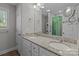 Bright bathroom with granite countertops, double sinks, and a large mirror at 975 Mt Moriah Church Rd, China Grove, NC 28023