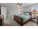 Well-lit bedroom with carpet features a wooden bed frame and furnishings at 975 Mt Moriah Church Rd, China Grove, NC 28023