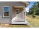 Charming entrance featuring a small porch, a white front door, and a window at 975 Mt Moriah Church Rd, China Grove, NC 28023