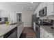 Modern kitchen featuring stainless steel appliances, granite countertops, and ample cabinet space, perfect for culinary enthusiasts at 975 Mt Moriah Church Rd, China Grove, NC 28023