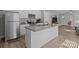 Bright kitchen featuring white cabinets, stainless steel appliances, and a granite island, seamlessly integrating into the home at 975 Mt Moriah Church Rd, China Grove, NC 28023