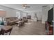 Bright and spacious living room with hardwood floors and modern furniture, seamlessly flowing into the kitchen at 975 Mt Moriah Church Rd, China Grove, NC 28023