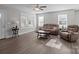 Inviting living room filled with natural light, featuring hardwood floors, comfortable seating, and a relaxing atmosphere at 975 Mt Moriah Church Rd, China Grove, NC 28023