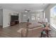 Cozy living room with hardwood floors, comfortable furnishings, and abundant natural light, creating an inviting space at 975 Mt Moriah Church Rd, China Grove, NC 28023