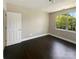 Cozy bedroom with hardwood floors, a window, and ample natural light, perfect for a relaxing retreat at 10406 Baskerville Ave, Charlotte, NC 28269