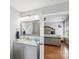 Bright bathroom with granite vanity, leading into a bedroom with hardwood floors, creating a seamless living space at 10815 Mountain Springs Dr, Charlotte, NC 28278