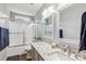 This bath features stylish gray cabinets, granite counters, and framed mirrors at 10815 Mountain Springs Dr, Charlotte, NC 28278