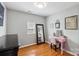 Cozy bedroom featuring a stylish vanity area and ample natural light, perfect for relaxation and personal grooming at 10815 Mountain Springs Dr, Charlotte, NC 28278