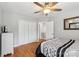 Bedroom featuring a comfortable bed, hardwood floors, ceiling fan, and closet with ample storage space at 10815 Mountain Springs Dr, Charlotte, NC 28278