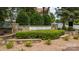 A stone community sign of Stowe Creek with professional landscaping and a white picket fence background at 10815 Mountain Springs Dr, Charlotte, NC 28278