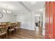 Bright dining room with a large table, wood floors, and contemporary chandelier at 10815 Mountain Springs Dr, Charlotte, NC 28278