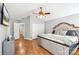 Inviting main bedroom with vaulted ceiling, ceiling fan, double closets, and doorway into hall and bath at 10815 Mountain Springs Dr, Charlotte, NC 28278