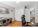 Versatile office space featuring a closet, shelving for storage and dark wood flooring at 10815 Mountain Springs Dr, Charlotte, NC 28278