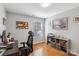 Functional home office space with dark wood desk, corkboard, shelving and natural light at 10815 Mountain Springs Dr, Charlotte, NC 28278