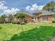 Spacious backyard featuring a well-maintained lawn, patio area perfect for outdoor gatherings at 11321 James Jack Ln, Charlotte, NC 28277