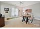 Comfortable bedroom with a unique putting green, American flag decor, and plenty of natural light at 11321 James Jack Ln, Charlotte, NC 28277