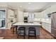 A well-appointed kitchen with a large island, stainless steel appliances, and hardwood floors at 11321 James Jack Ln, Charlotte, NC 28277