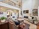 Spacious living room with fireplace, tall ceilings, balcony view, and comfortable seating area at 11321 James Jack Ln, Charlotte, NC 28277
