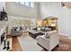 Bright living room with a fireplace, tall ceilings, and french doors leading to the exterior at 11321 James Jack Ln, Charlotte, NC 28277