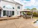 Backyard patio features an outdoor kitchen, built-in grill, seating, and direct access to the home at 123 Yellow Jacket Cir, Mooresville, NC 28117