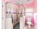 Modern tiled bathroom with glass enclosed shower, toilet, and neutral tile at 123 Yellow Jacket Cir, Mooresville, NC 28117