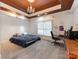 Cozy bedroom with a bed, desk area, dark ceiling and chandelier, perfect for relaxation and study at 123 Yellow Jacket Cir, Mooresville, NC 28117