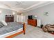 Spacious bedroom with a wooden bed, dresser, a massage chair, and ample natural light at 123 Yellow Jacket Cir, Mooresville, NC 28117