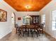Formal dining room with unique ceiling, chandelier, and traditional furniture at 123 Yellow Jacket Cir, Mooresville, NC 28117