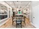 Kitchen with island, breakfast table, stainless appliances, tile floors, and coffered ceiling at 123 Yellow Jacket Cir, Mooresville, NC 28117