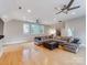 Spacious living room features a comfortable seating area and gleaming hardwood floors at 123 Yellow Jacket Cir, Mooresville, NC 28117