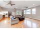 Large living room with hardwood floors, neutral paint, and natural light at 123 Yellow Jacket Cir, Mooresville, NC 28117