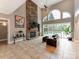 Spacious living room with stone fireplace, large windows, and access to the outdoor pool area at 123 Yellow Jacket Cir, Mooresville, NC 28117