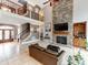 Living room with a stone fireplace and views of the staircase and front entry at 123 Yellow Jacket Cir, Mooresville, NC 28117