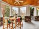 Covered porch featuring a wooden table and chairs, perfect for outdoor dining and relaxation at 123 Yellow Jacket Cir, Mooresville, NC 28117