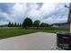 View of a large, fenced backyard with a concrete patio at 133 Pheasant Run Rd, Troutman, NC 28166