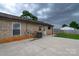 A brick home with a concrete patio and a fully fenced-in backyard at 133 Pheasant Run Rd, Troutman, NC 28166
