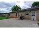 Back of a brick house showing a concrete patio and fenced-in backyard at 133 Pheasant Run Rd, Troutman, NC 28166