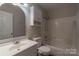 Bathroom with tub-shower combo, white cabinets, and modern sink at 133 Pheasant Run Rd, Troutman, NC 28166
